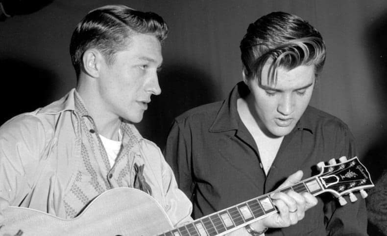 Scotty Moore and Elvis Presley